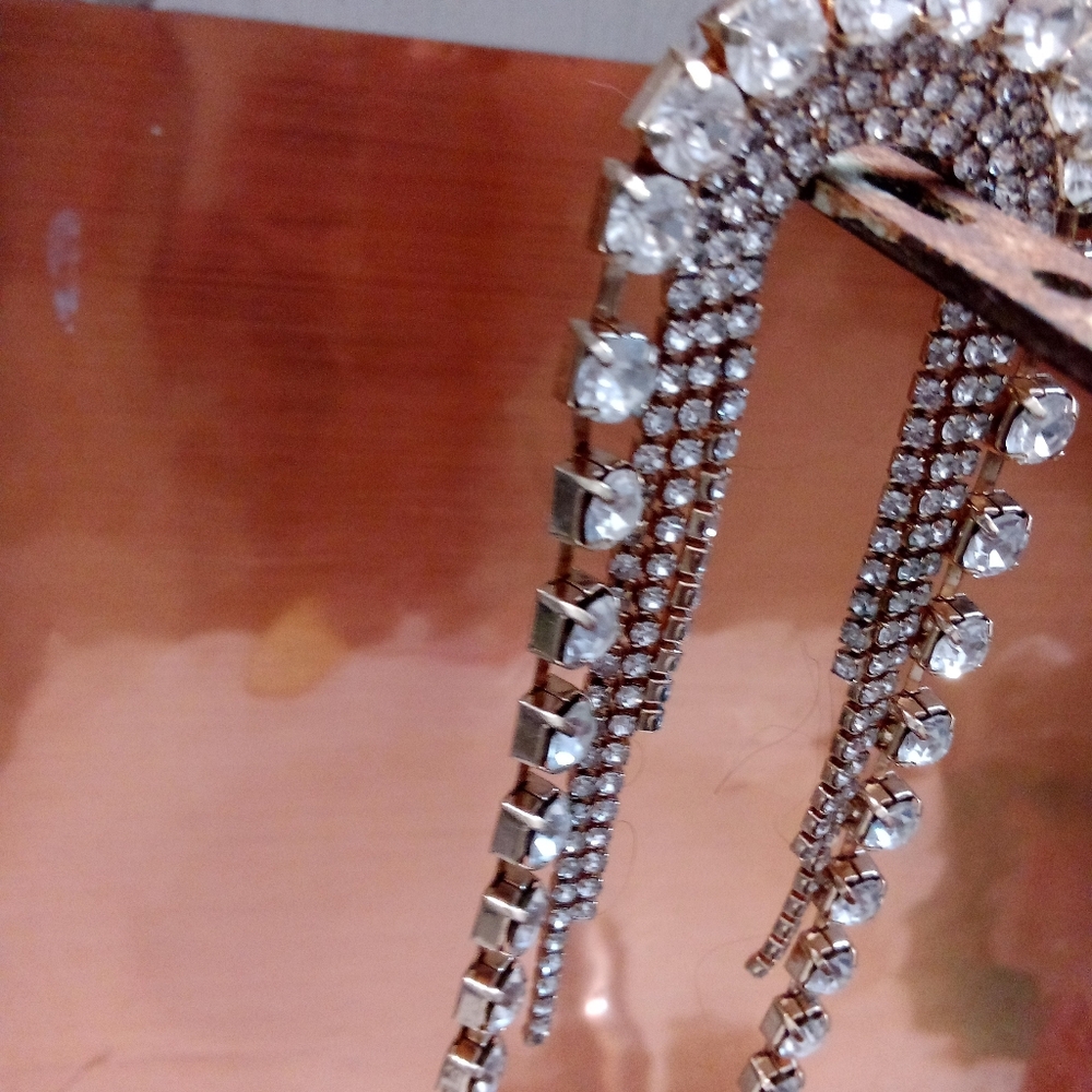 One long big rhinestone earring